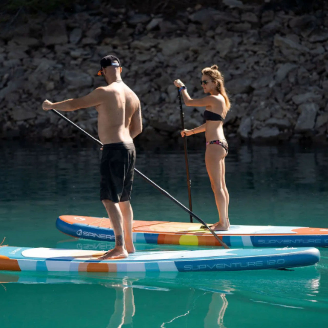 Spinera SUP Supventure Sunset 10.6 With a Couple Paddling on Calm Water