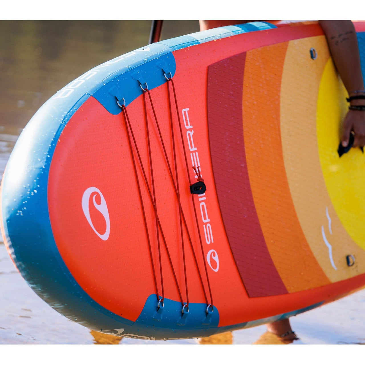 Spinera SUP Supventure Sunset 10.6 With a Person Holding with Water Background