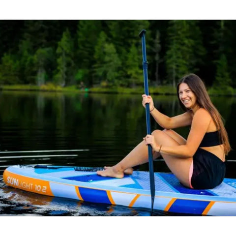 Spinera Sun Light 10.2 Paddle Board With a Girl Sitting Happily