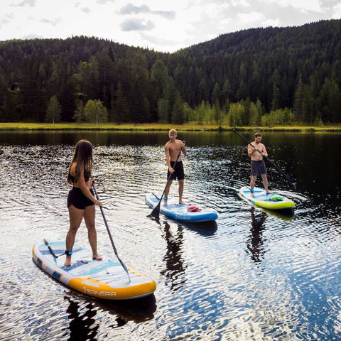 Spinera Sun Light 10.2 Paddle Board With a Group Paddling Together Amidst Forested Hills