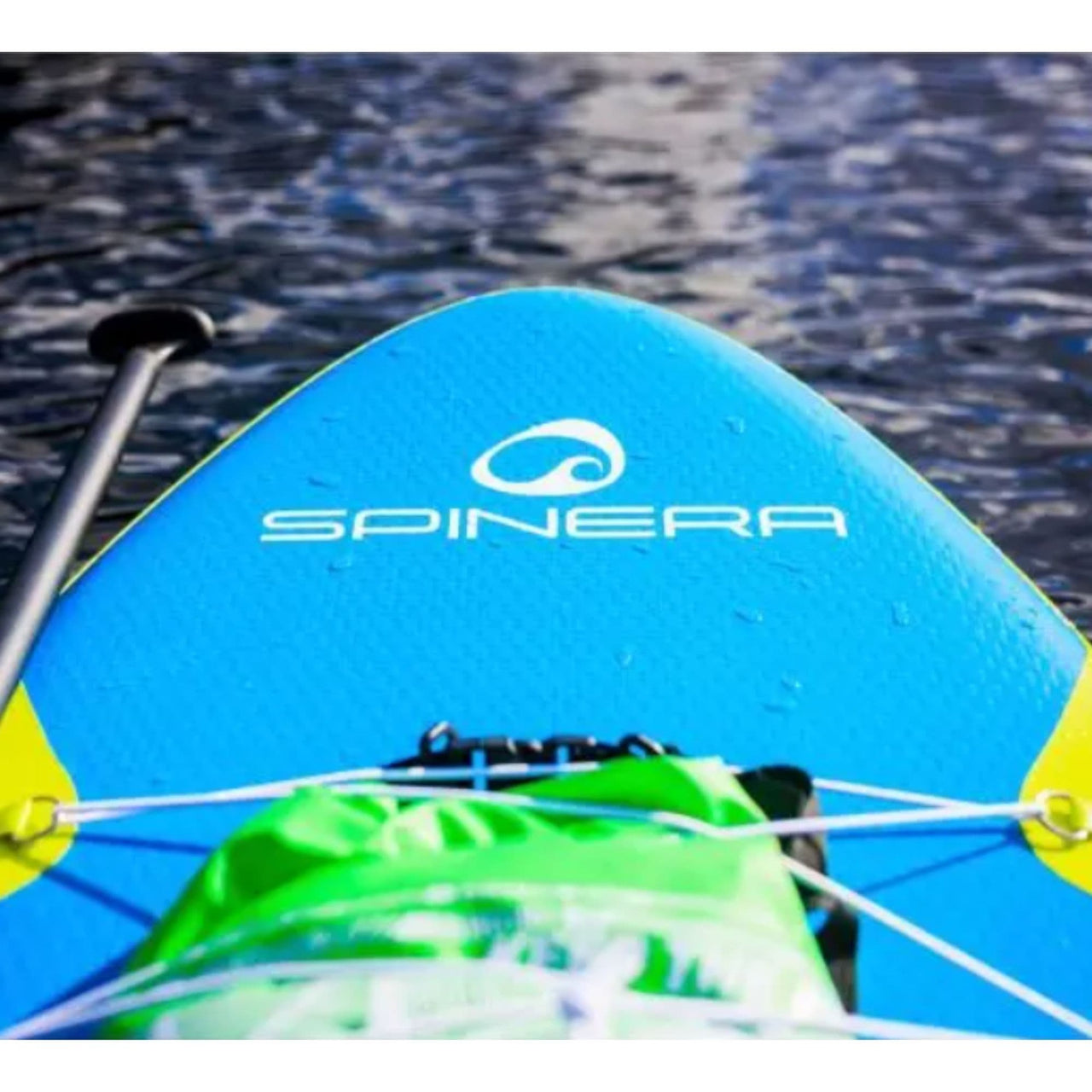 Spinera Sun Light 11.0 Paddle Board With a Gear Floating on Calm Water