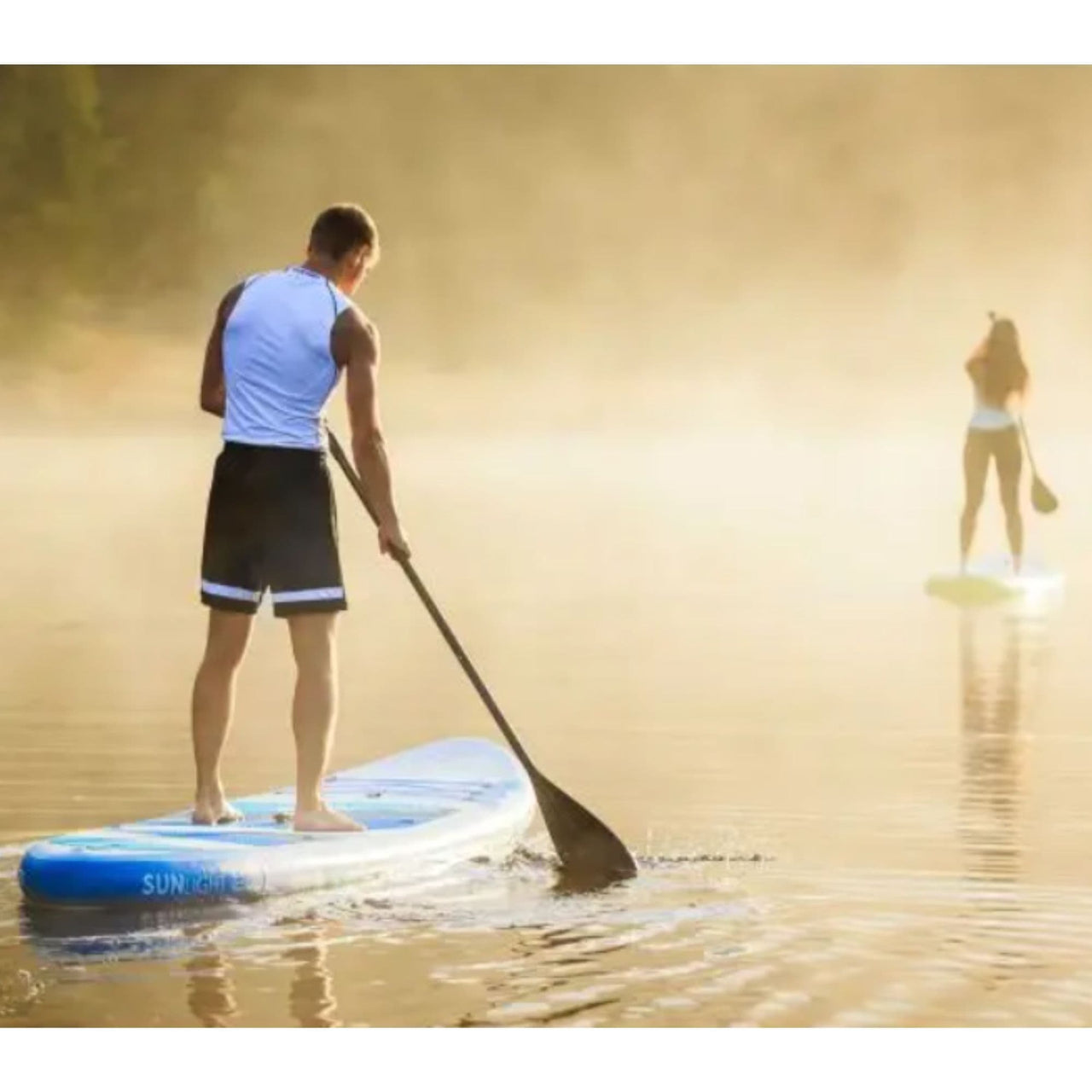 Spinera Sun Light 11.0 Paddle Board With a Man and Woman Paddling Together