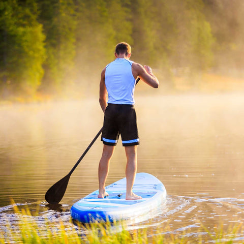 Spinera Sun Light 12.0 Paddle Board With a Man Paddling on Misty Lake