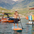 Thumbnail for Spinera Supventure Sunrise 12 Paddle Board With a Man Paddling Next to a Boat with Mountain Background