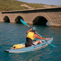 Thumbnail for Spinera Tenaya 120 Inflatable Kayak With a Man Kayaking Approaching Stone Bridge In Blue Water