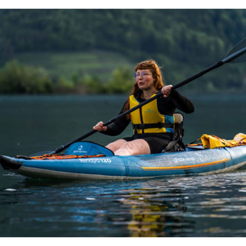 Spinera Tenaya 120 Inflatable Kayak With a Woman Kayaking And Paddling In Calm Waters