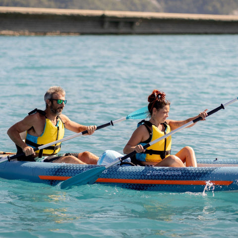 Spinera Tenaya 140 Inflatable Kayak With A Man And Woman Paddling Vigorously