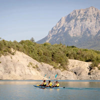 Thumbnail for Spinera Tenaya 160 Inflatable Kayak With Three People Kayaking Together On Blue Water With Mountain Background