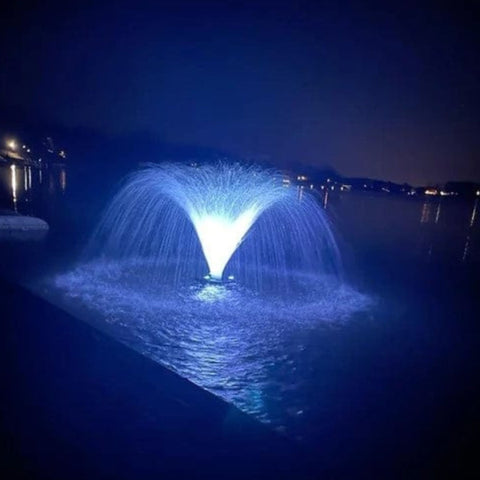 Transform Your Water Feature with Vanguard LED Color Changing Fountain Lights Glowing Blue On Lake At Night