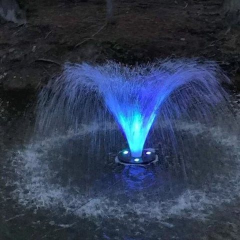 Transform Your Water Feature with Vanguard LED Color Changing Fountain Lights Wide Spray Front View With Bright Blue Lights At Night