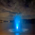 Transform Your Water Feature with Vanguard LED Color Changing Fountain Lights With Glowing Blue Lighting Beneath Cloudy Night Sky