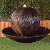 Tuscany Without Riser Garden Fountain By Gist With Bamboo Plants And Wooden Fence Behind