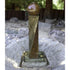 Thumbnail for Twist Rock Fountain With Ball Finial And Rock Texture On A Rock Garden And Gravel Bed With Wooden Bench In The Background