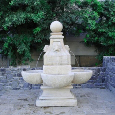 Venetian Lion Outdoor Water Fountain With Stacked Rock Wall And Greenery Background