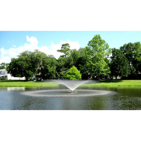 Vertex FunnelJet Floating Pond Fountain With Green Tress And White House Behind