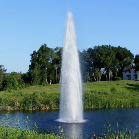 Vertex GeyserJet Floating Fountain Water Rises Before The Trees And Big House