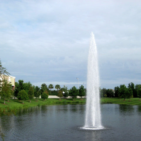 Vertex GeyserJet Floating Pond Fountain With Elegant House And Beautiful Landscape Behind