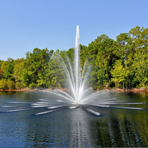 Vertex Vertical TriTier Floating Pond Fountain On The Water With Green Trees In The Background