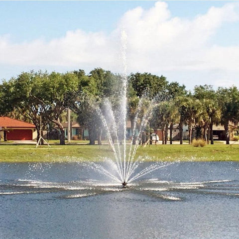Vertex Vertical TriTier Pond Fountain On The Water With Trees & Houses In The Background