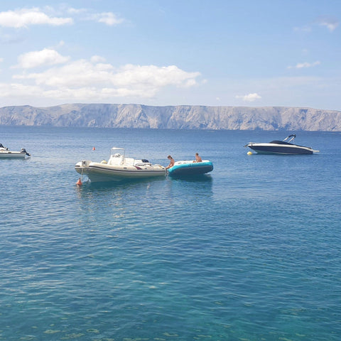 Wing 5 Towable With Three Boats and Mountain Background