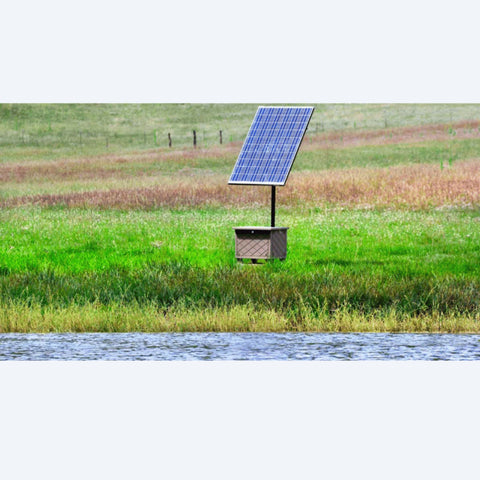 Solaer solar powered aeration system beside a lake and field